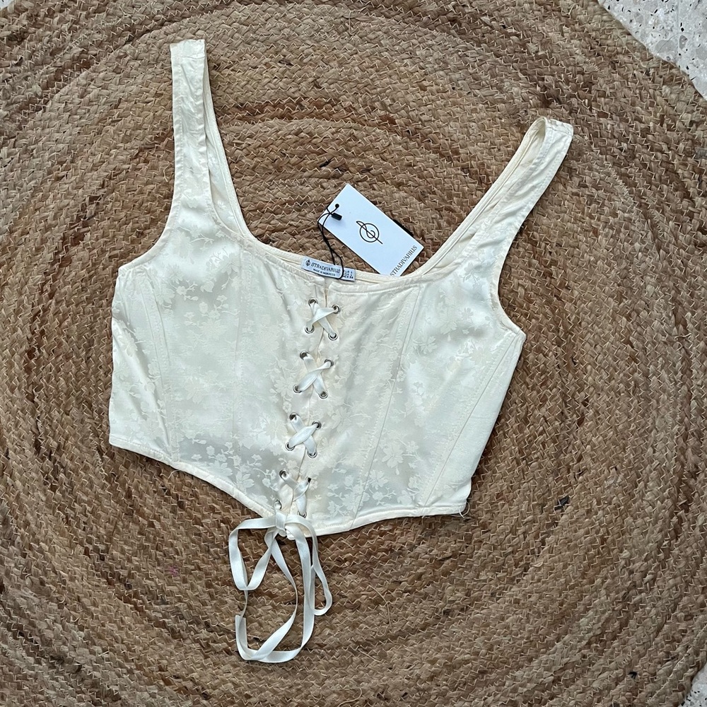 NWT Stradivarius Ivory Bustier Top with Self Tie Front Lace Detail. Size L.